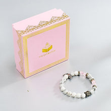 Load image into Gallery viewer, Howlite &amp; Rose Quartz Bracelet with Buddha and Angel Wings
