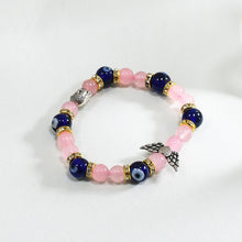 Load image into Gallery viewer, Rose Quartz &amp; Evil Eye Bracelet with Buddha and Angel Wings Charm
